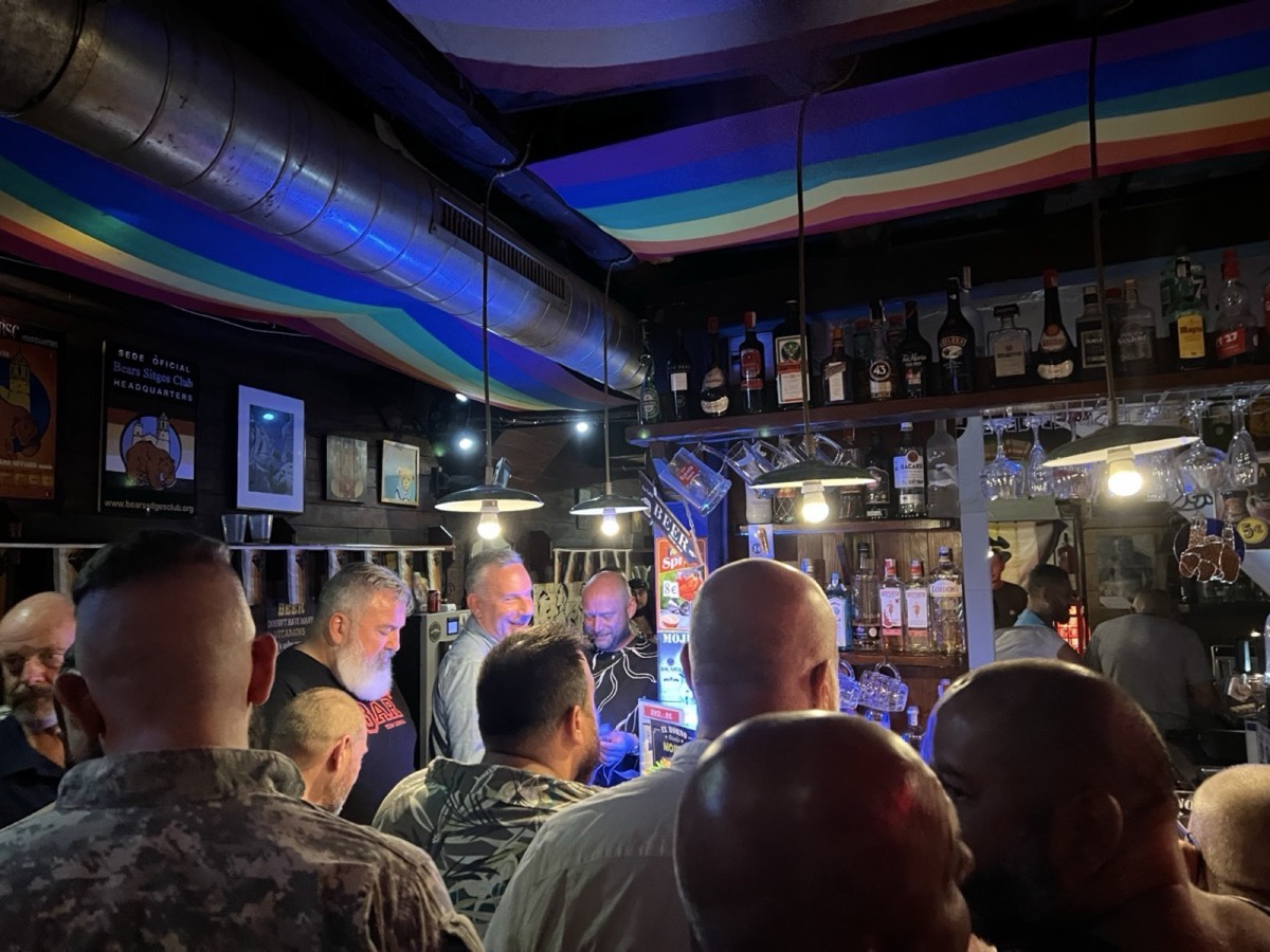 The interior of a gay bar with rainbow ceiling lights in Sitges, Spain